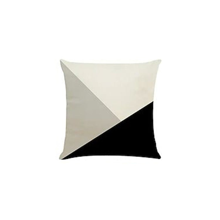 Cushion cover with large cream, grey and black triangular panels.