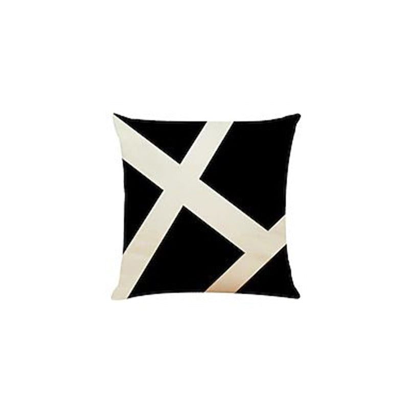 Black cushion cover with broad intersecting cream diagonal lines.