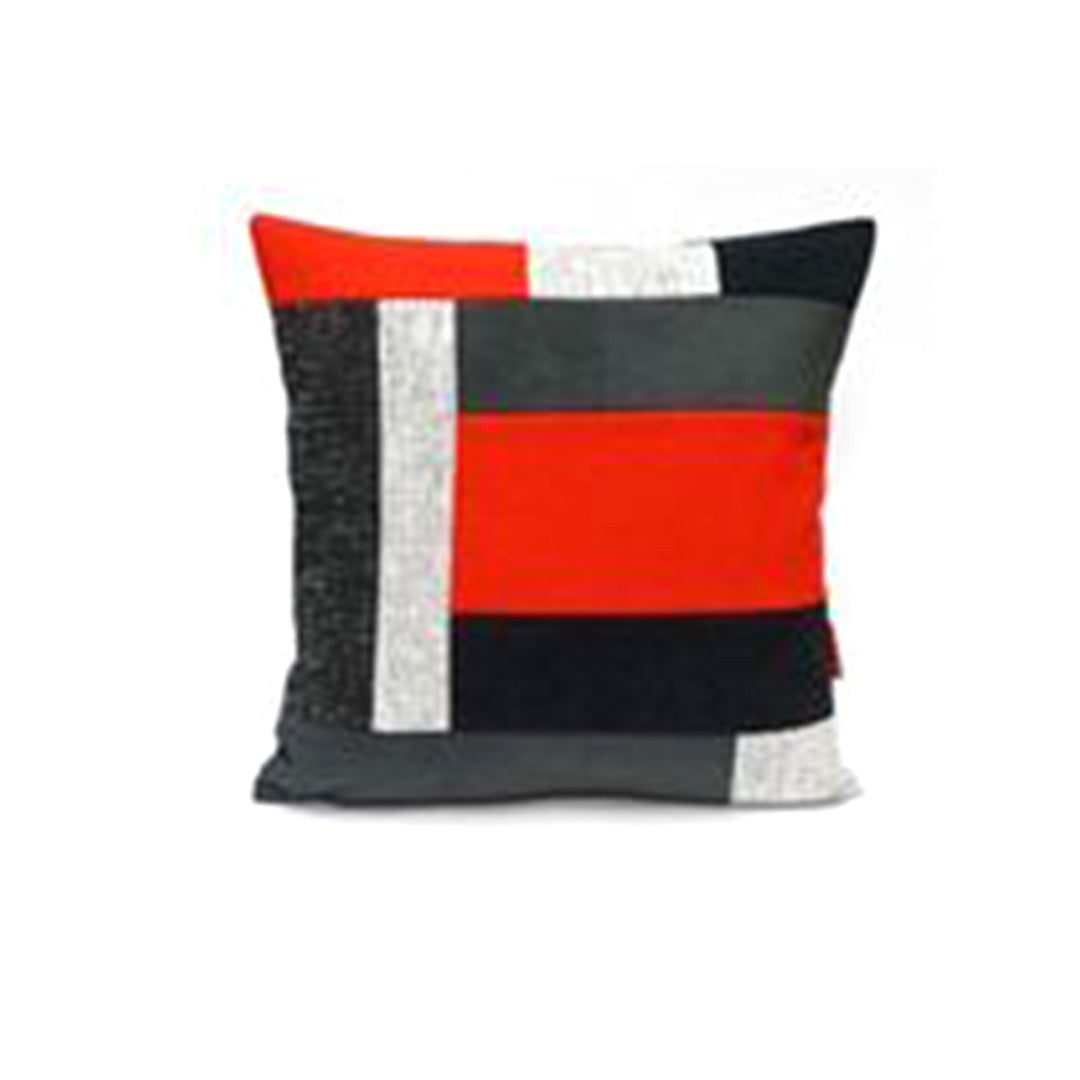 Cushion cover with overlapping black, grey, white and red rectangular panels.