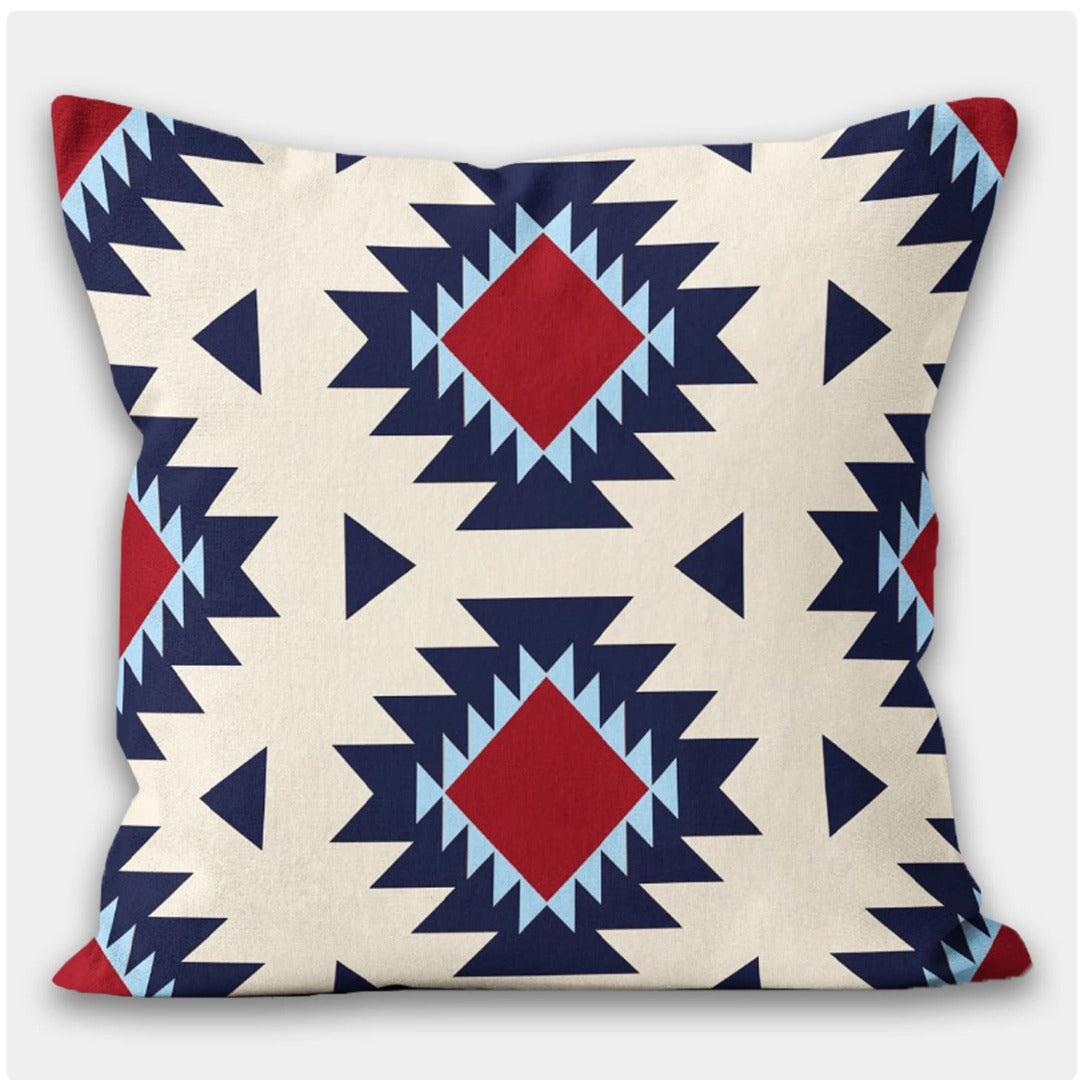 Cream cushion cover with large navy and red stepped diamonds.