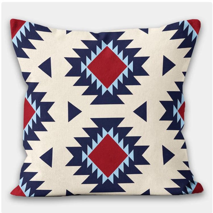 Cream cushion cover with large navy and red stepped diamonds.