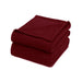 Folded burgundy waffle-weave cotton thermal blanket.