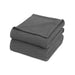 Folded charcoal waffle-weave cotton thermal blanket.