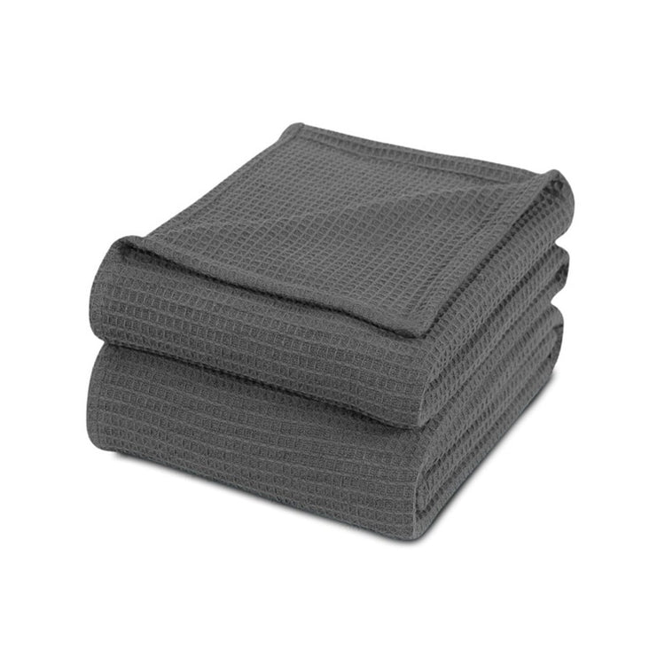 Folded charcoal waffle-weave cotton thermal blanket.