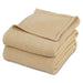 Folded beige waffle-weave cotton thermal blanket.