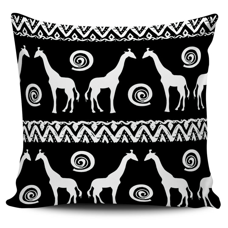 Black cushion cover with white giraffes, spirals and geometric borders.