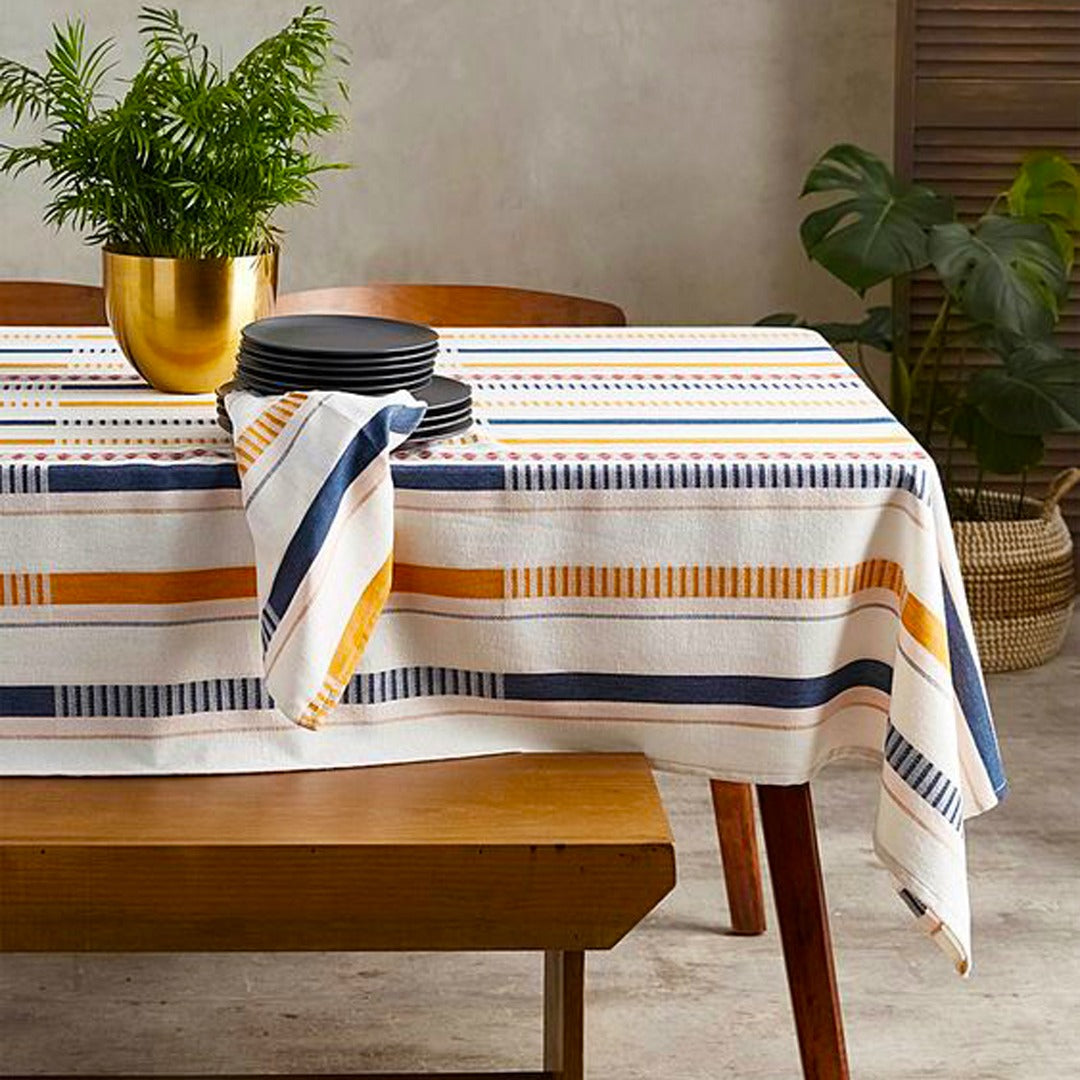 Cream tablecloth with navy and mustard horizontal stripes.