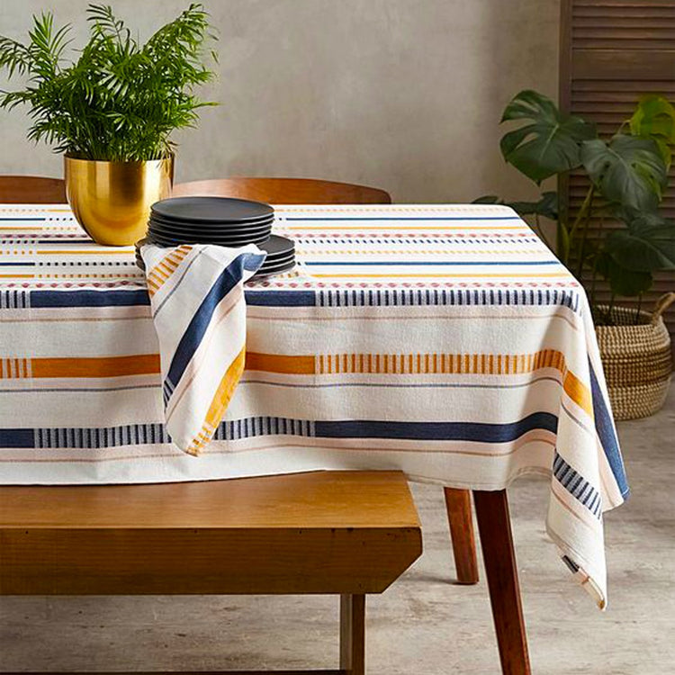 Cream tablecloth with navy and mustard horizontal stripes.