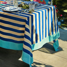 Blue and cream striped tablecloth with a turquoise border.
