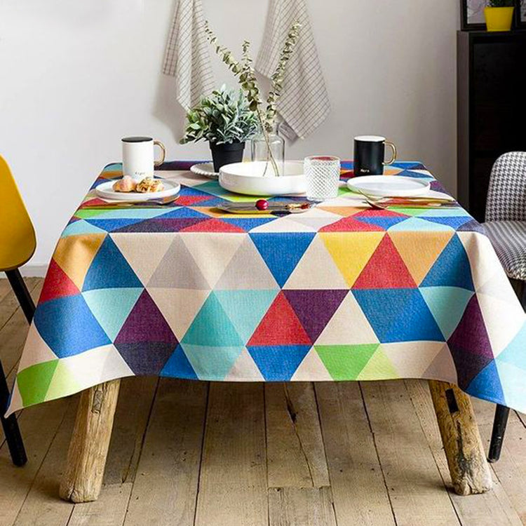Tablecloth with multicoloured geometric triangles.