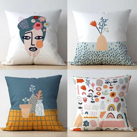 Four cushion covers with abstract face, vase, flower and illustrated motif designs.