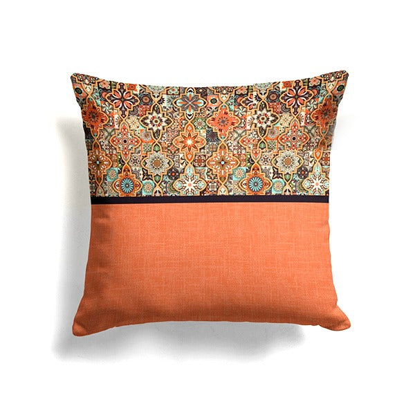 Cushion cover with an ornate multicoloured top panel above a plain orange section.