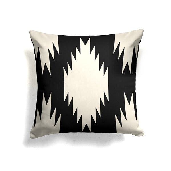 Black cushion cover with a large cream stepped diamond.