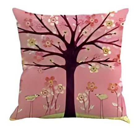 Pink cushion cover with a dark tree and small white flowers.