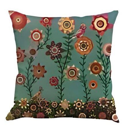 Teal cushion cover with tall colourful flowers and a floral border along the bottom.