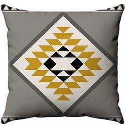 Grey cushion cover with a white diamond filled with mustard and black triangles.