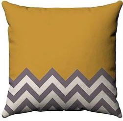 Mustard cushion cover with grey and white zigzag bands along the bottom.