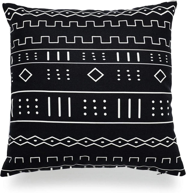 Black cushion cover with horizontal bands of small white lines and diamonds.