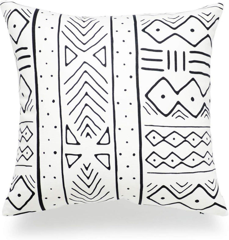 White cushion cover with vertical black bands of diamonds, lines and small marks.
