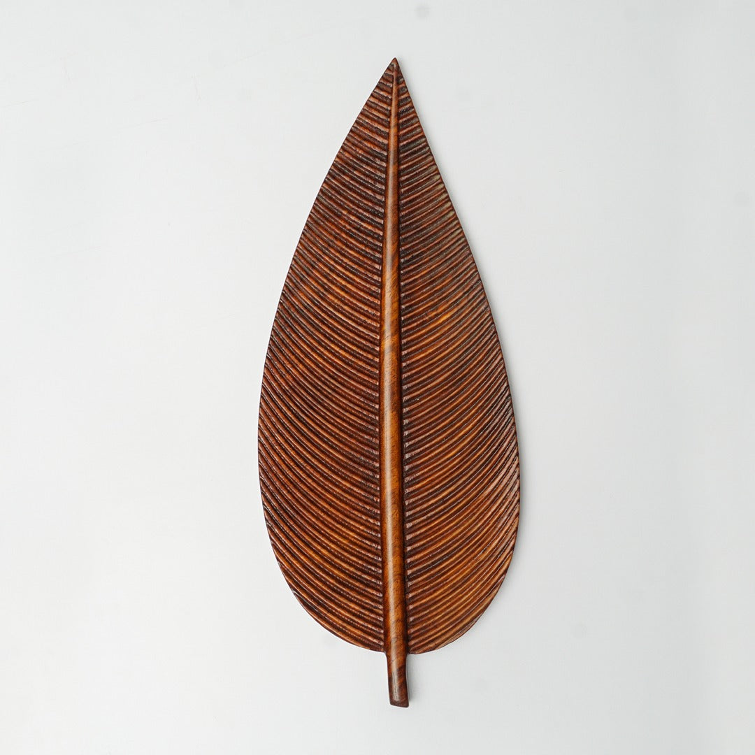 Single brown leaf-shaped tray viewed from above
