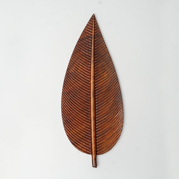 Single brown leaf-shaped tray viewed from above
