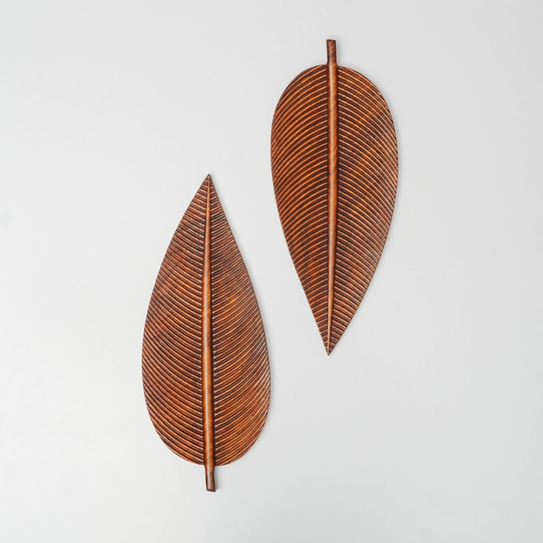 Two brown leaf-shaped trays arranged in opposite directions