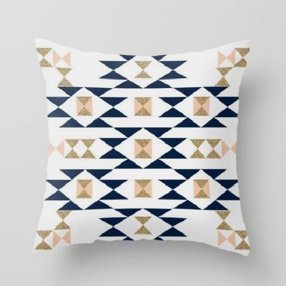 Cream cushion cover with navy and beige geometric diamonds and triangles.
