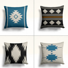 Four teal, black and cream cushion covers with stepped diamond motifs.