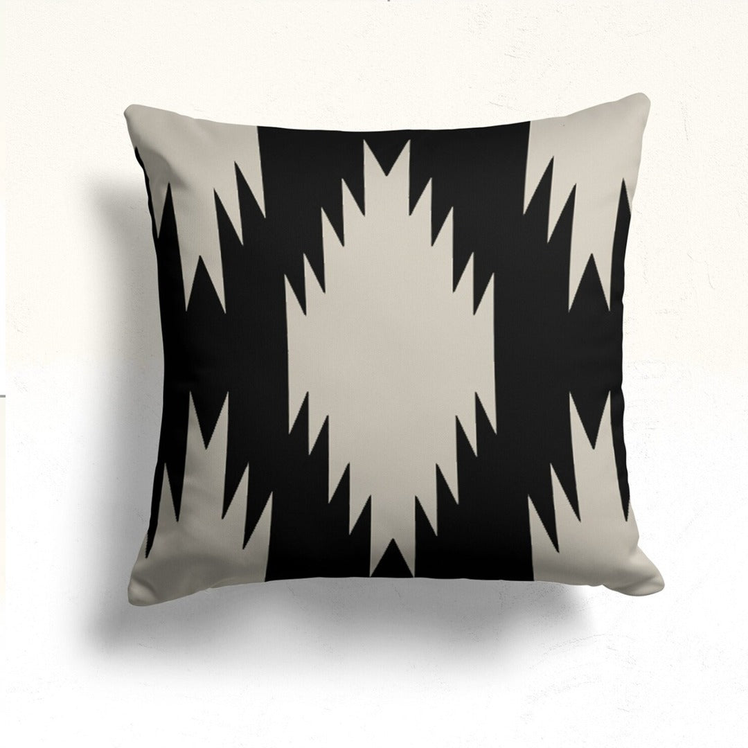 Black cushion cover with a large cream stepped diamond.