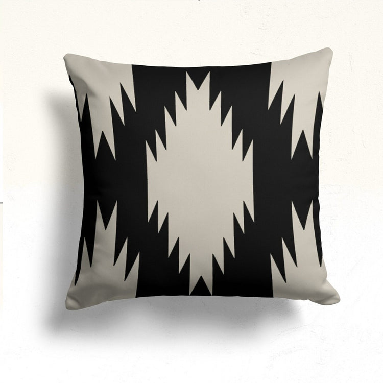 Black cushion cover with a large cream stepped diamond.