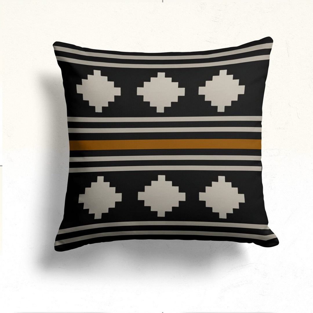 Black cushion cover with cream diamonds and narrow cream and mustard horizontal stripes.