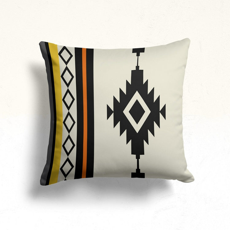 Cream cushion cover with a black stepped diamond and mustard and orange side stripes.
