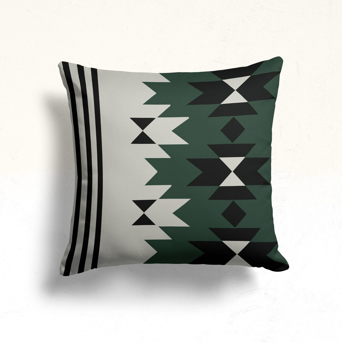 Cream cushion cover with green and black geometric columns and black side stripes.