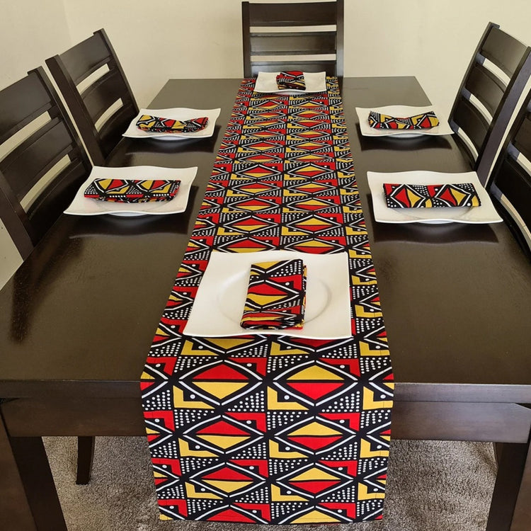 Red, yellow and navy diamond-pattern table runner with matching placemats.