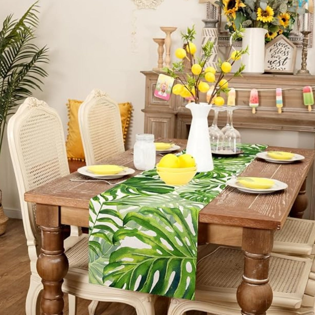 Green tropical-leaf table runner in a dining-room setting