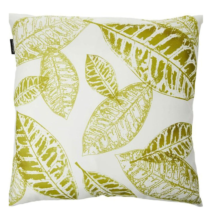White cushion cover with overlapping light green leaf prints.