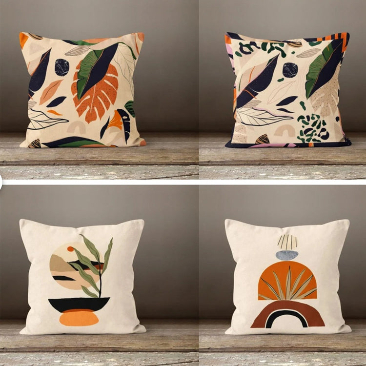 Four cream cushion covers with botanical and abstract earth-tone illustrations.