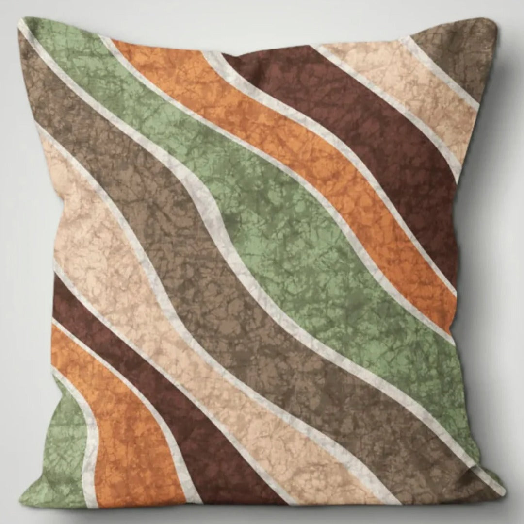 Cushion cover with diagonal flowing bands of green, rust, brown and cream.