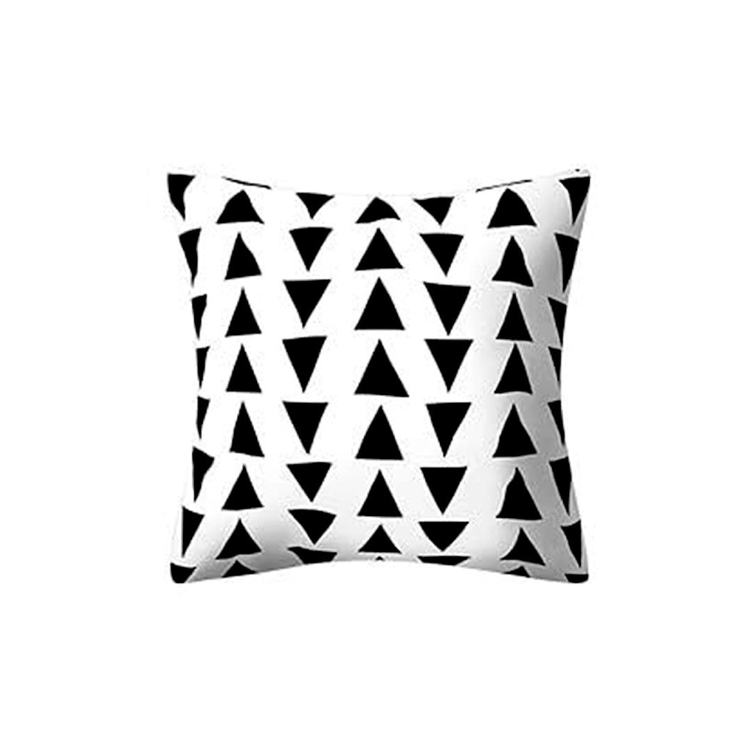 White cushion cover with rows of small black triangles.
