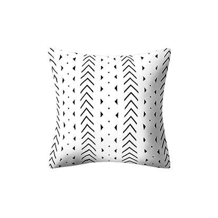 White cushion cover with thin black chevrons, dotted lines and small marks.