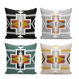 Four cushion covers with multicoloured geometric cross motifs on different backgrounds.