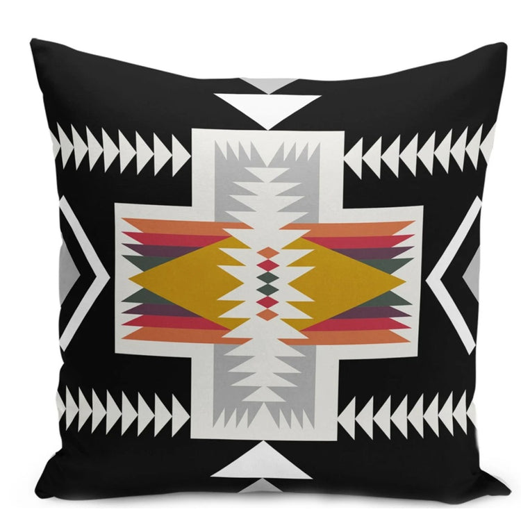 Black cushion cover with a cream geometric cross and rust, yellow and grey details.