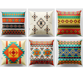 Six colourful cushion covers with geometric bands and stepped diamond patterns.