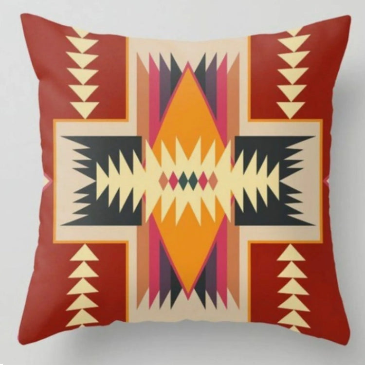 Rust cushion cover with a cream geometric cross and yellow, purple and black details.