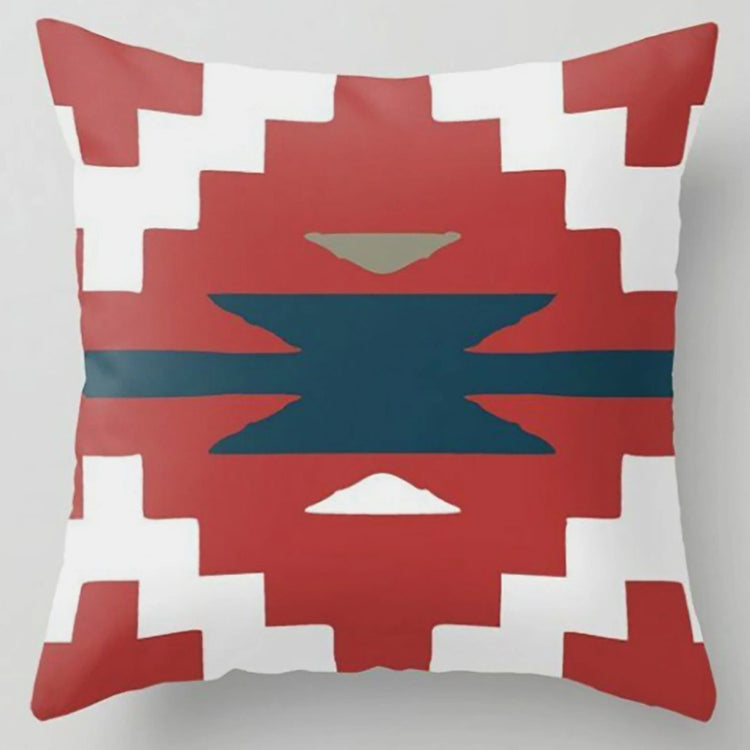 Cushion cover with a rust stepped diamond and dark teal centre on white.