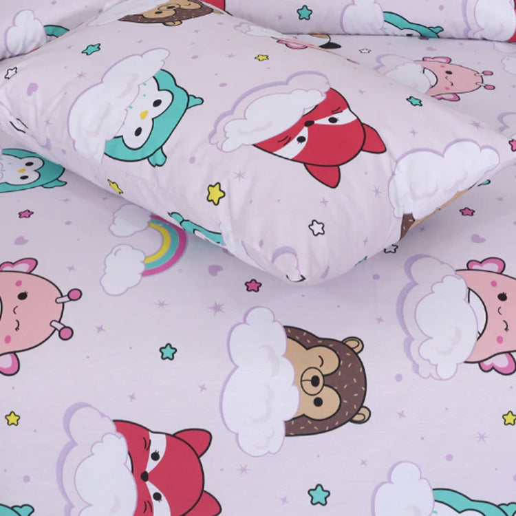 Close-up of a pink pillowcase and bedsheet with small cartoon animal prints.
