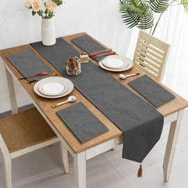 Grey velvet table runner with matching grey placemats.