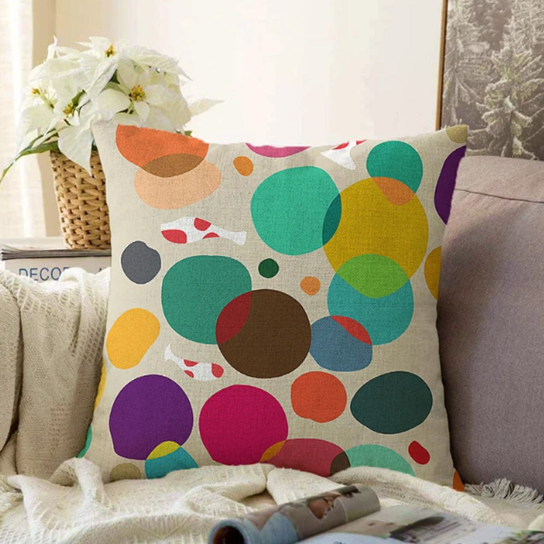 Cream cushion cover with overlapping circles in bright colours.