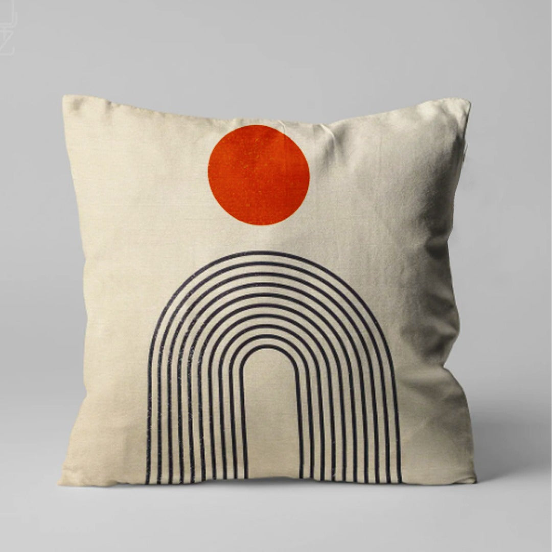 Cream cushion cover with an orange circle above a black lined arch.