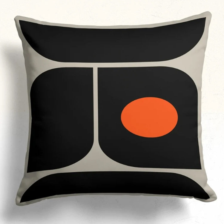Cushion cover with rounded black panels, cream dividing lines and an orange circle at the right.